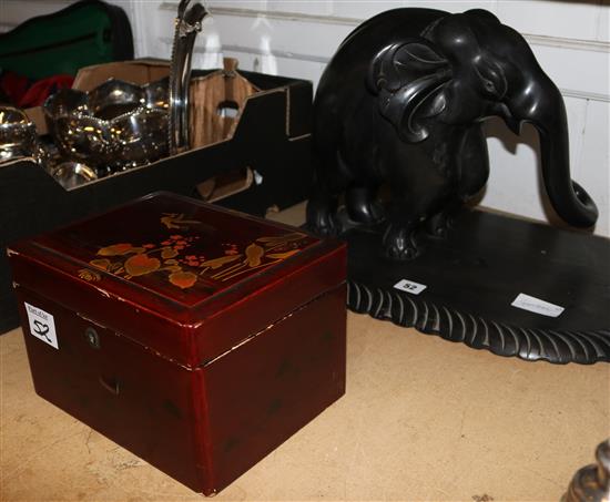 Large ebony elephant on stand and a Japanese lacquer box